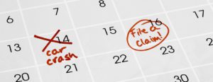 A calendar marked with the date of a car crash and filing a claim two days later.