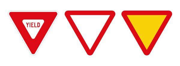 A US YIELD sign versus international GIVE WAY signs which are similar, minus the text.