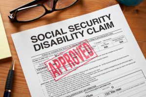 social security disability claim form with red approved stamp