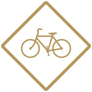 Icono dorado de una señal de tráfico de bicicletas.