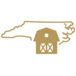 Gold outline of the state of North Carolina with a farm building.