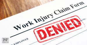 declined claim form for workers' compensation with a red DENIED stamp.