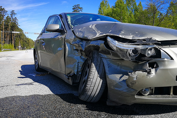 Crushed in front end of a car after an accident.