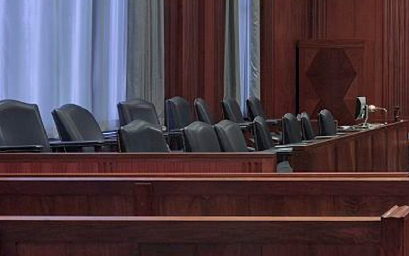 Chairs in the jury box in a courtroom.