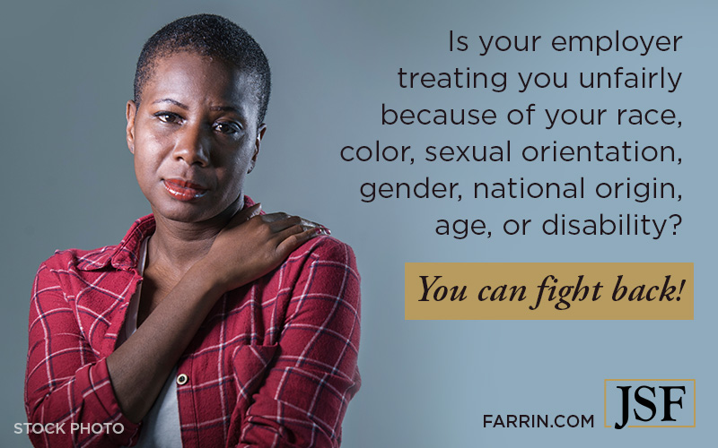 A Black woman wearing a red plaid shirt, looking concerned and worried.