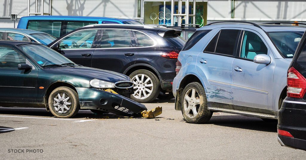 Law Offices of James Scott Farrin car accident attorneys in the Carolinas. Two vehicles with front-end damage after collision in parking lot.